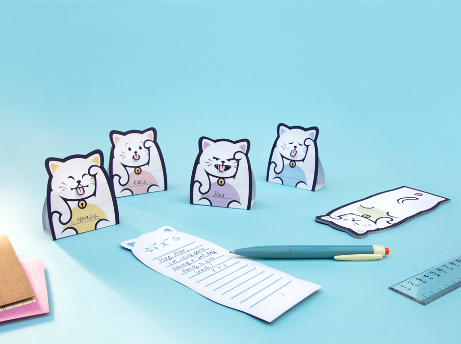 Lucky Cat Message Pads folded up on desk