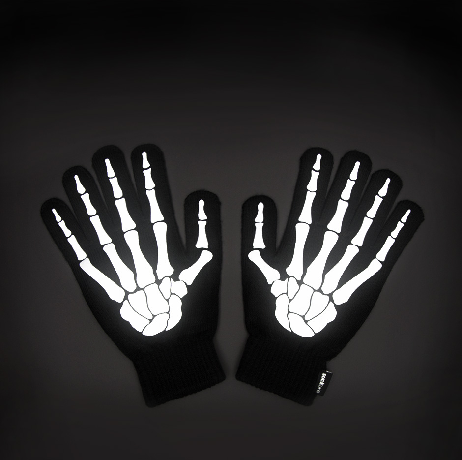 Reflective skeleton gloves on black background