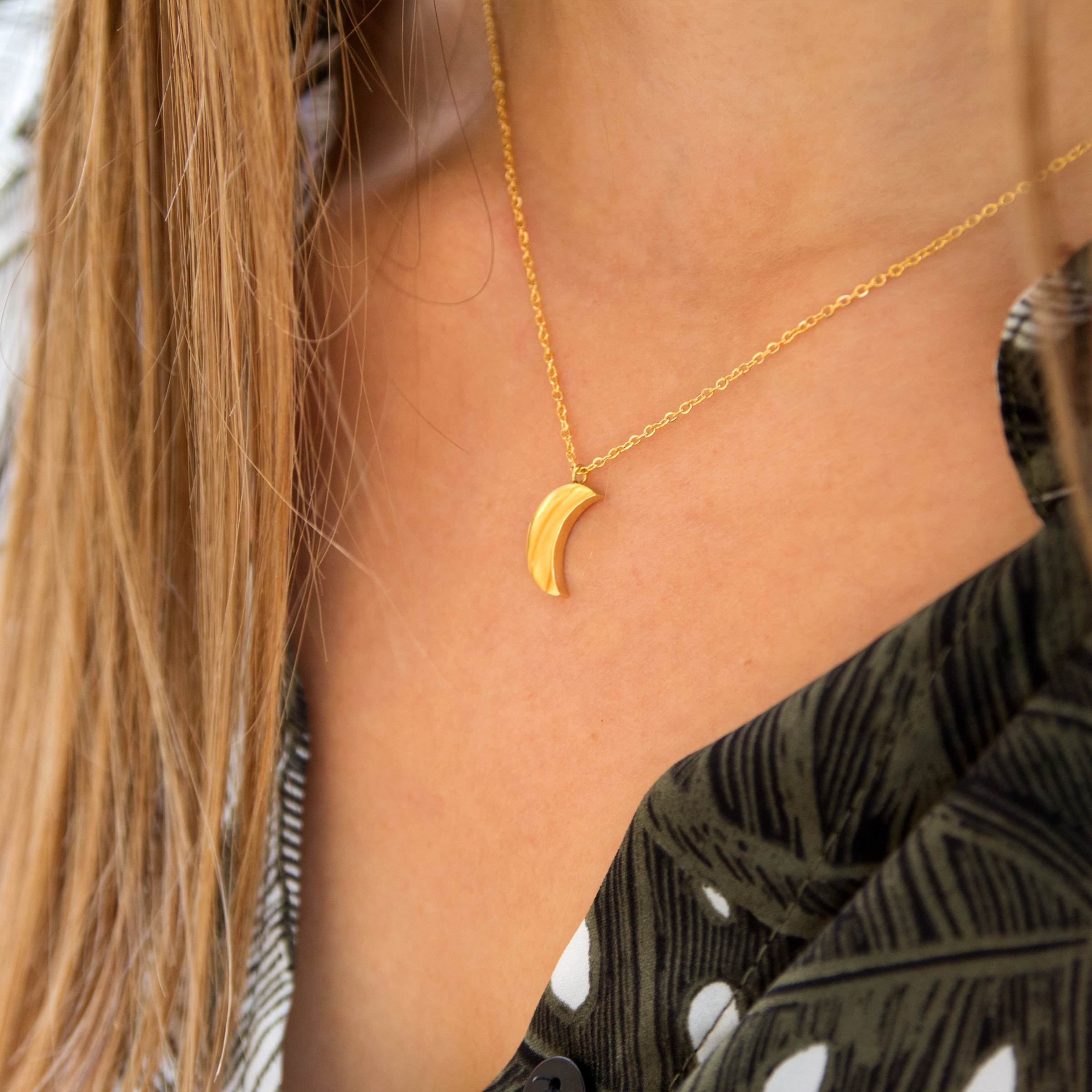 Kuku gold crescent moon necklace on model