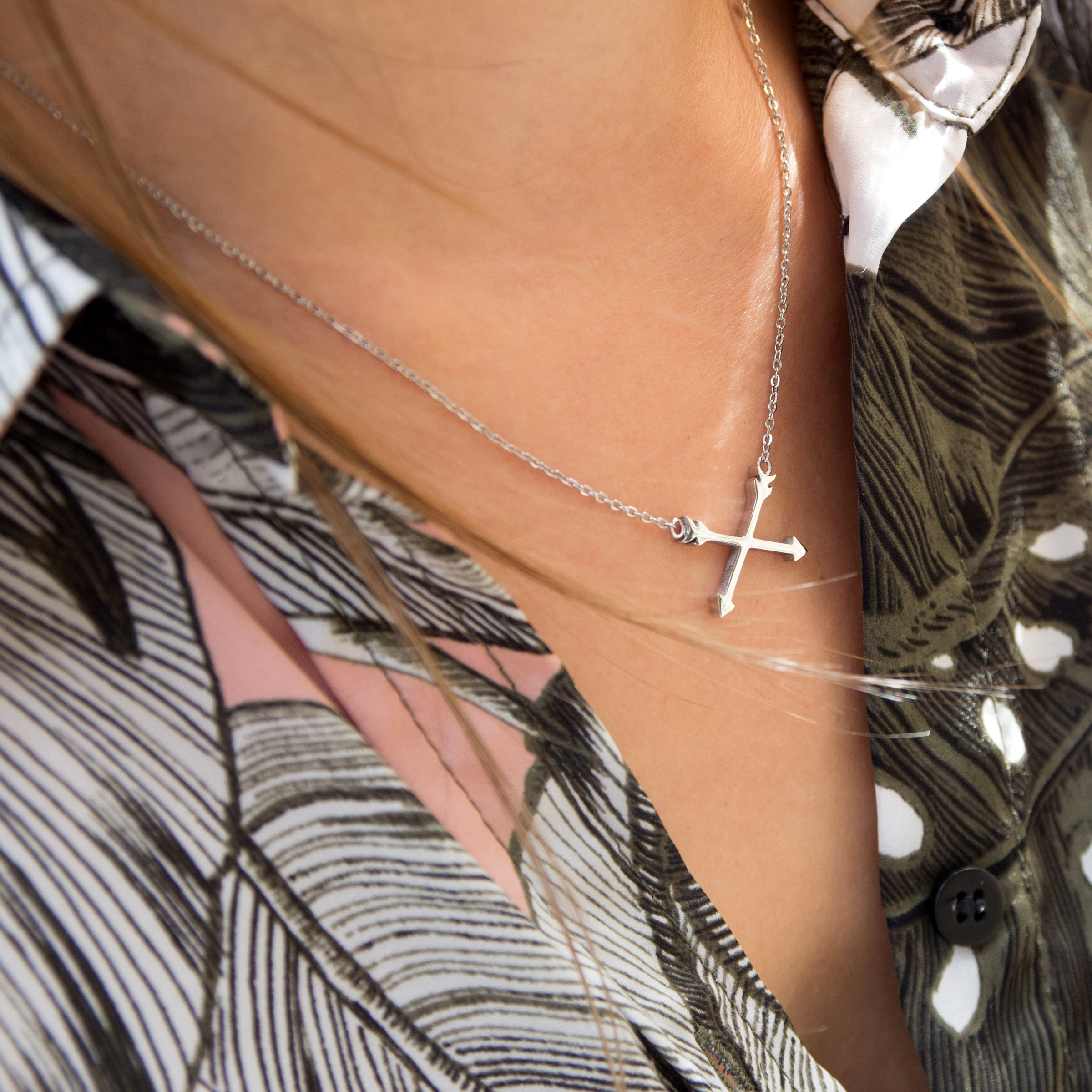Kuku silver arrow necklace on model