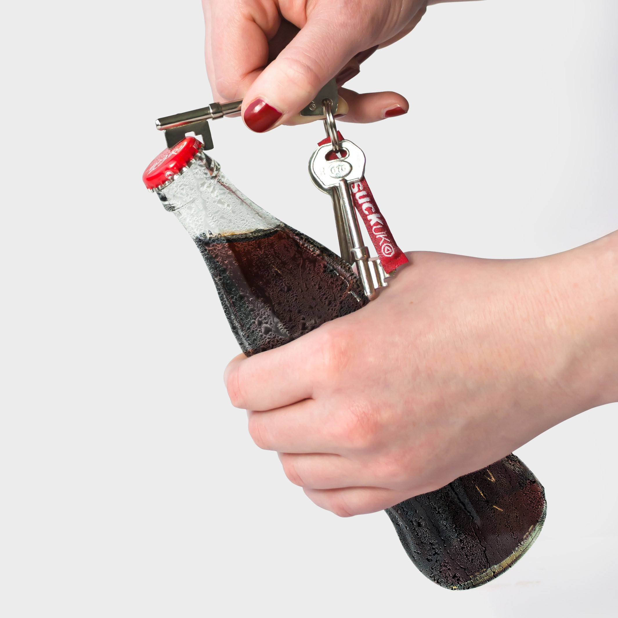 Key Chain Bottle Opener in the shape of a key