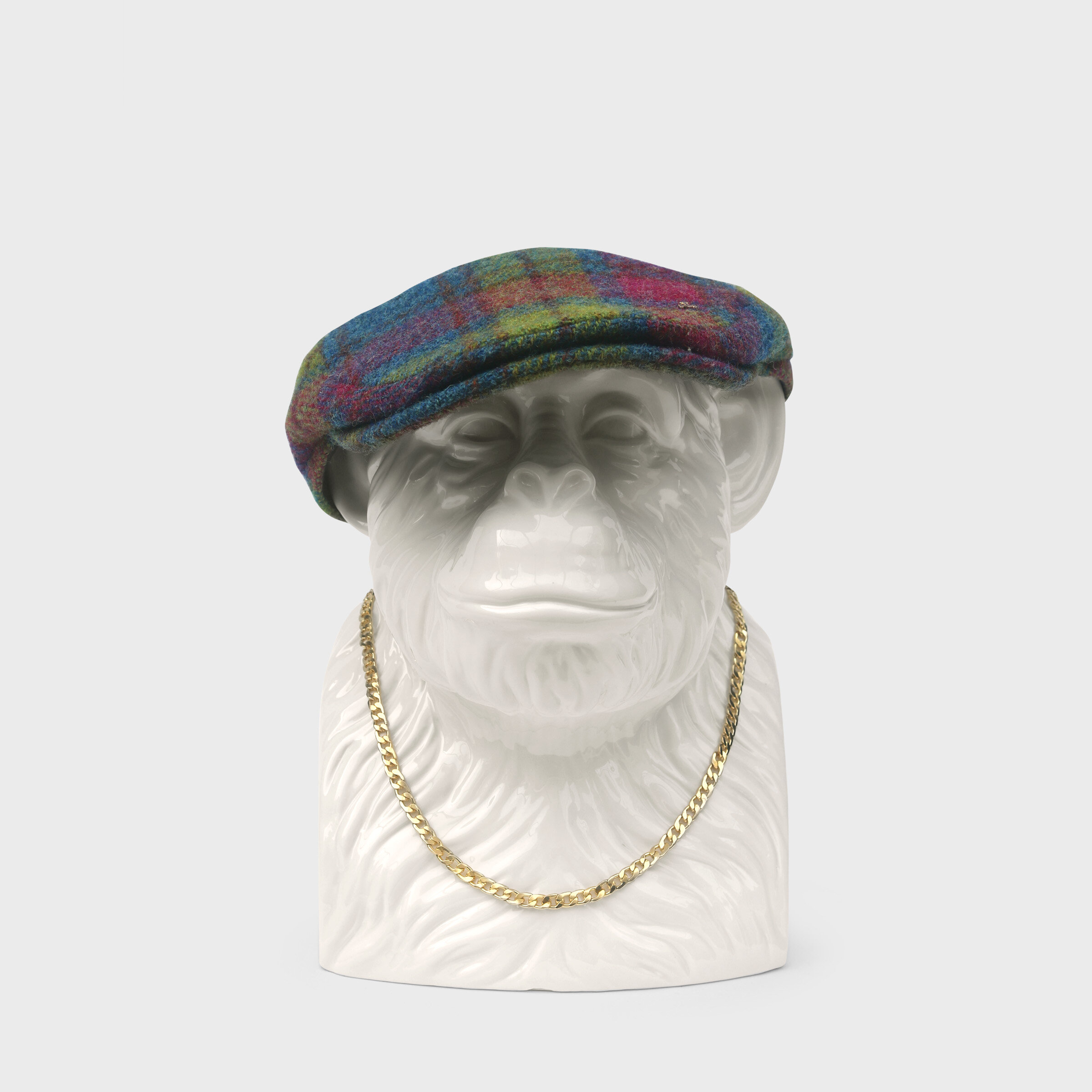 chimp with flat cap and necklace