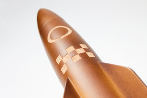 Dark wooden rocket grinder close up