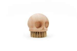 solid beech wood brush shaped like a skull