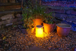 solar light jar in garden lighter