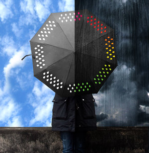 Clever umbrella changes colour when in rains. Showing dry and wet conditions.