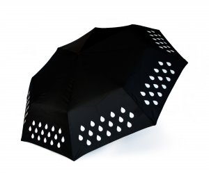 Black umbrella. Changes colour when in rains. Showing the simple white design before it has contacted with water.