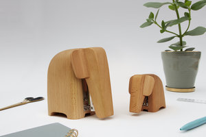 pair of wooden staplers on desk