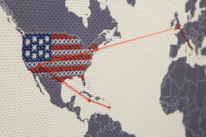 embroider world map with america stitched closeup