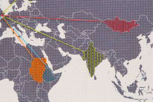 world map embroidery closeup