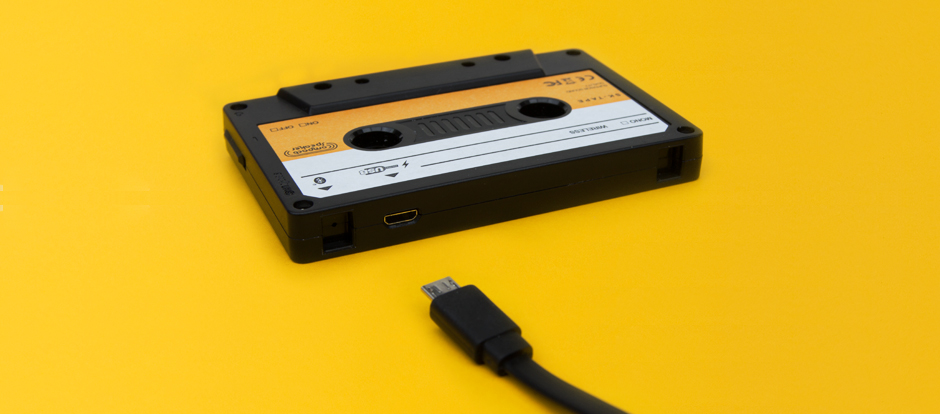 Close up of cassette speaker with charging cable
