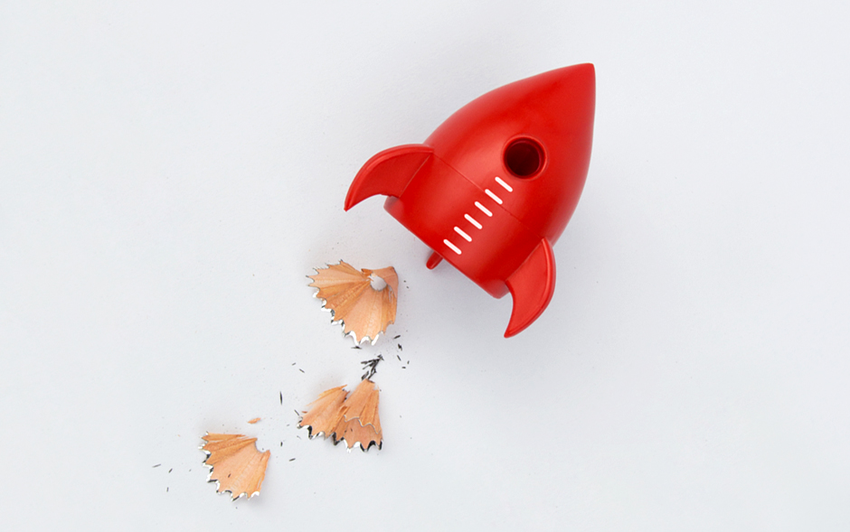 Red rocket pencil sharpener with pencil shavings