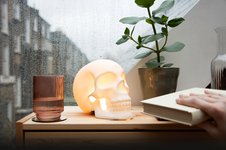 Ceramic skull light on bedside table