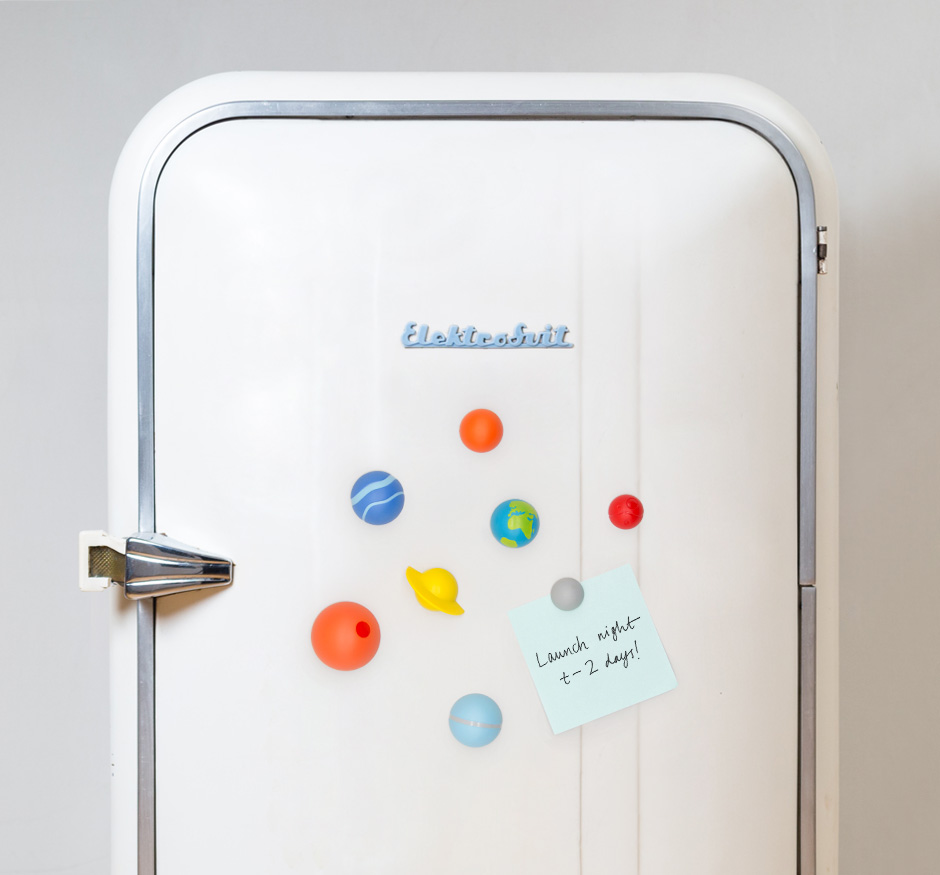 Solar system magnets on vintage fridge door