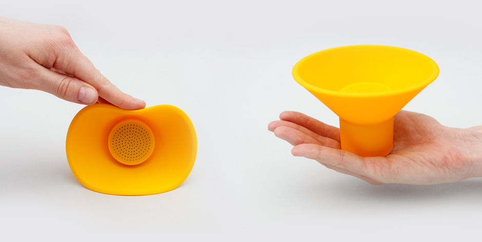 Hands holding yellow icon speaker