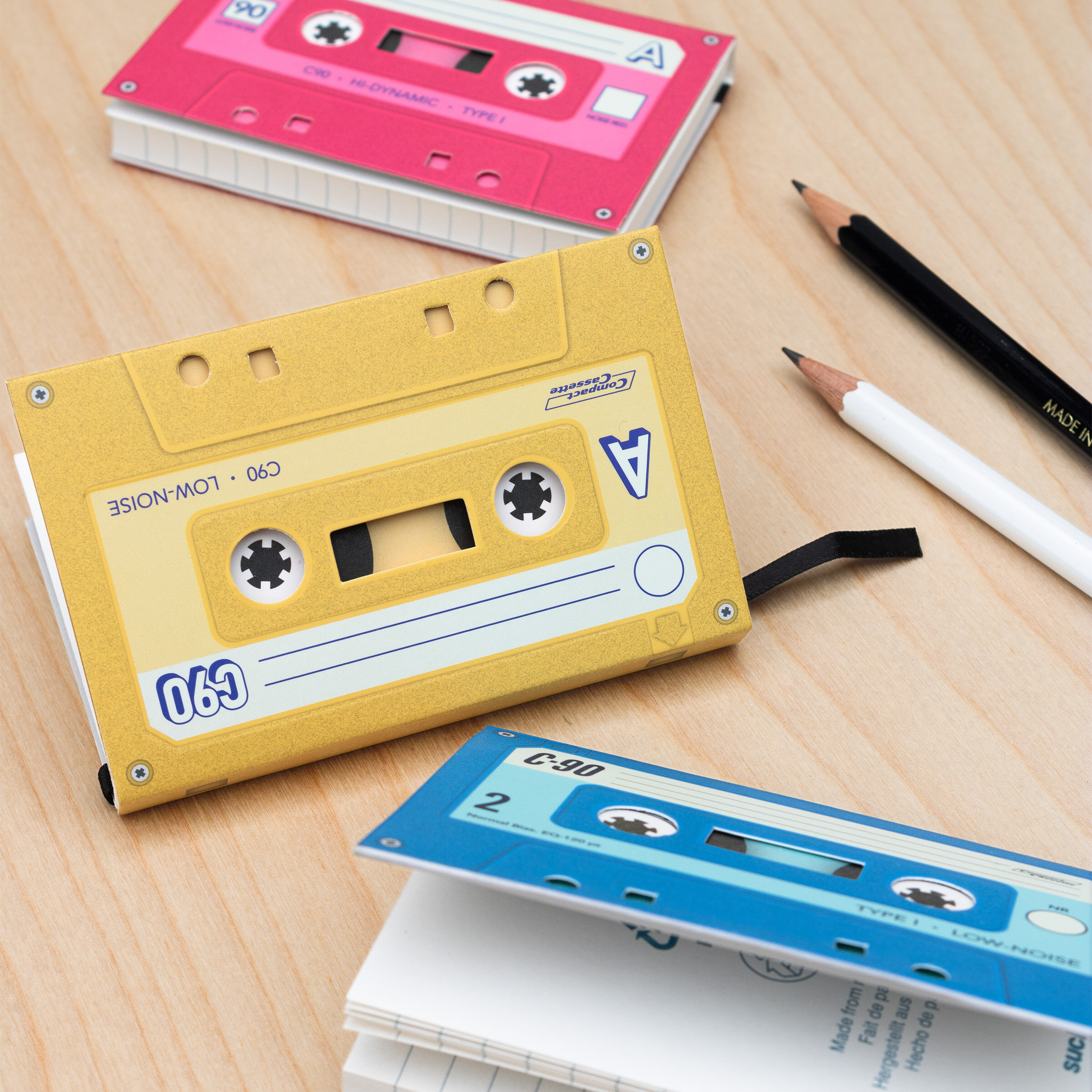 three small pocket sized notebooks