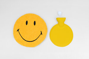 smiley face yellow hot water bottle layout