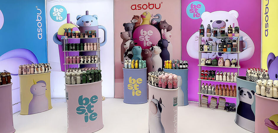 Asobu Bestie Bottles stand at Harrogate Home & Gift Festival featuring colourful displays and character-inspired reusable bottles.