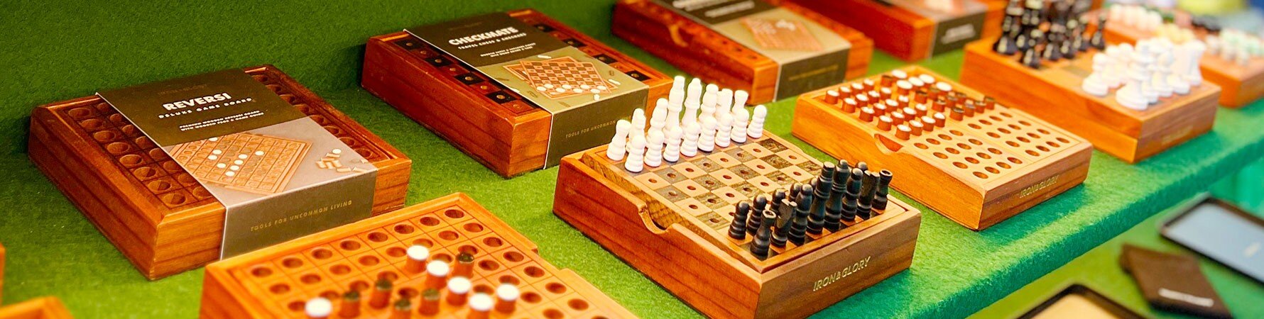 Iron & Glory classic wooden games on display at SuckUK's Top Drawer 2025 stand – including chess, reversi, and Sudoku gifts