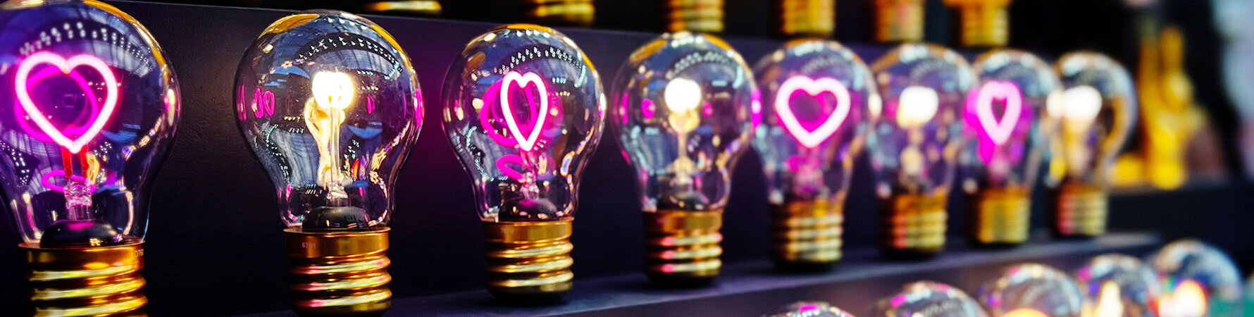 SuckUK pink heart light bulbs displayed at Top Drawer 2025 - part of the creative gift lighting collection