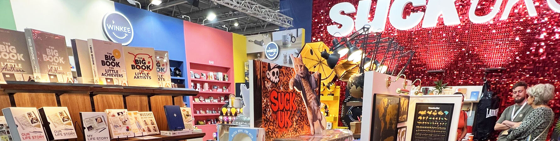 Full view of SuckUK’s Top Drawer 2025 showcase at Olympia London, including Iron & Glory, Smiley, and Eat My Socks collections.