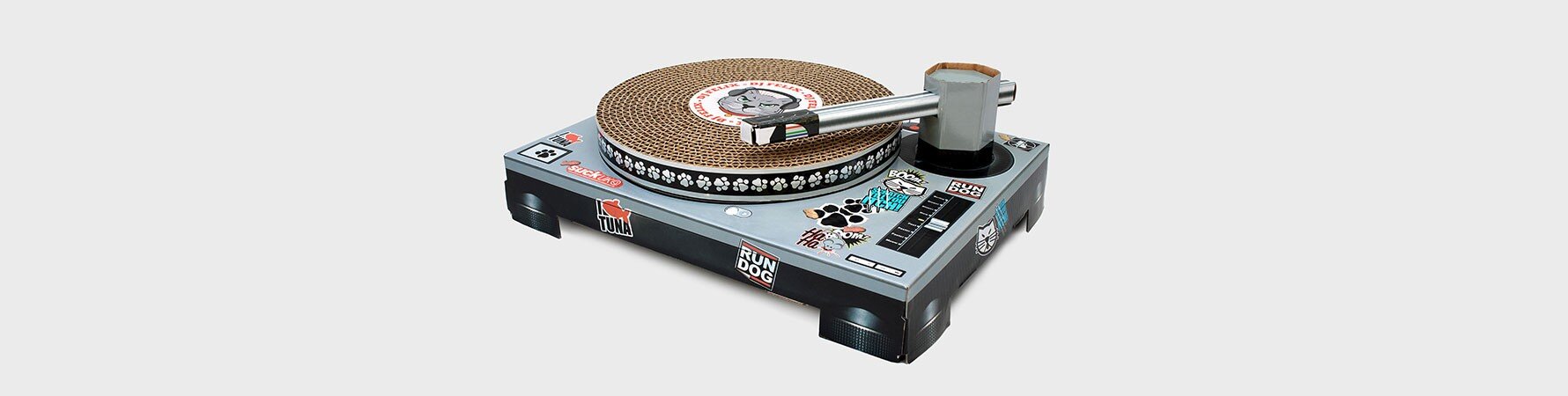 The Suck UK Cat Scratch Turntable - a cardboard DJ-style cat scratching toy with a scratch platter and poseable tone arm.