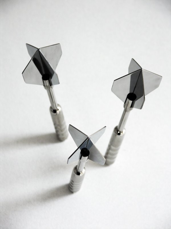 Dart Coat Hooks Strong metal darts screw into the wall.