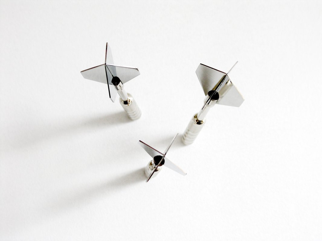 Dart Coat Hooks Strong metal darts screw into the wall.