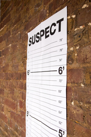 Close up view of height chart on brick wall