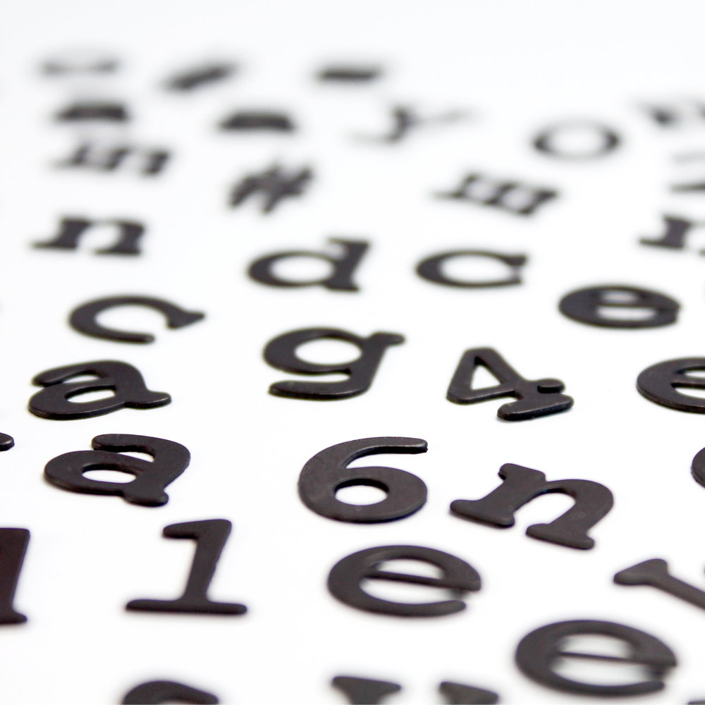 close up of black magnetic alphabet