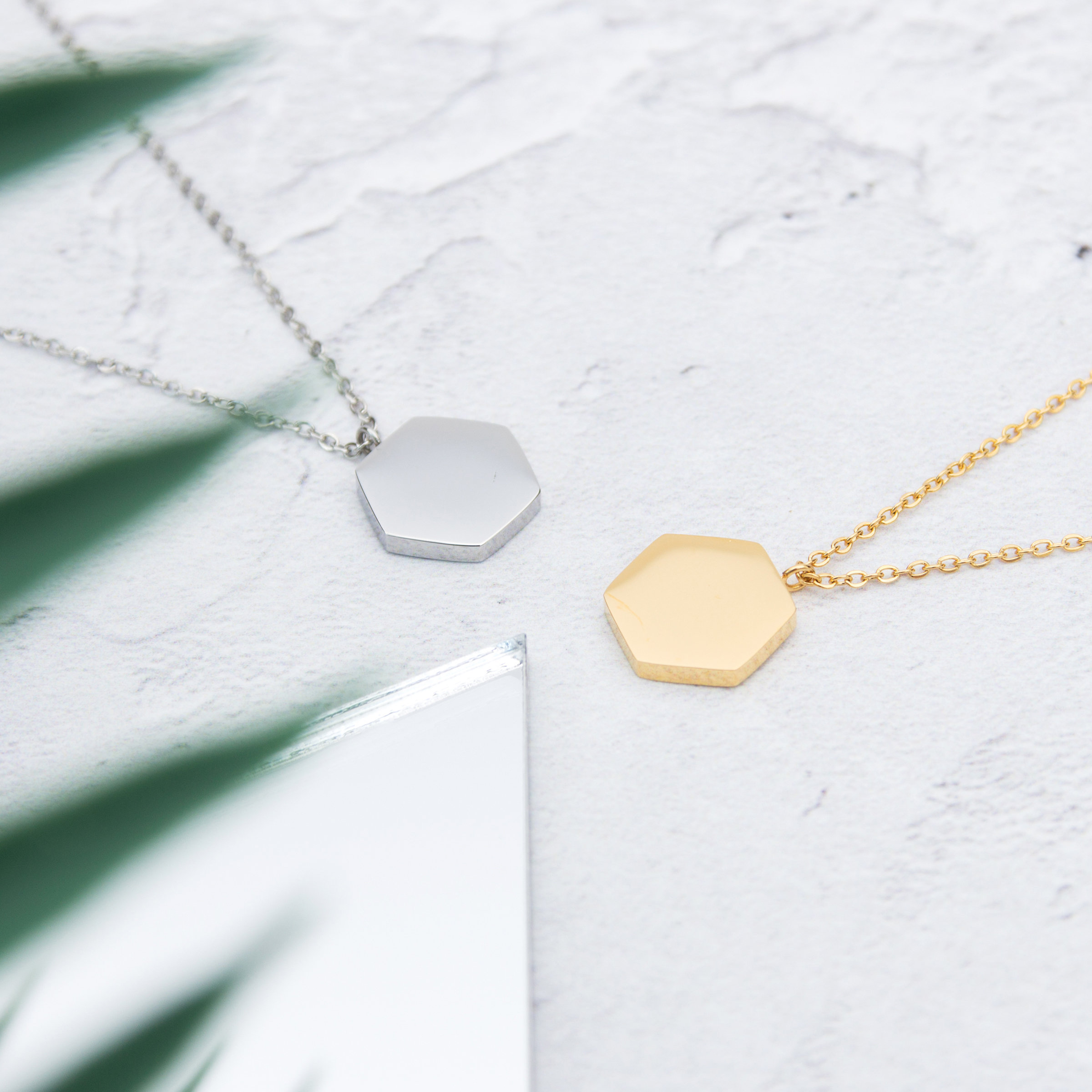 Kuku gold and silver hexagon necklaces