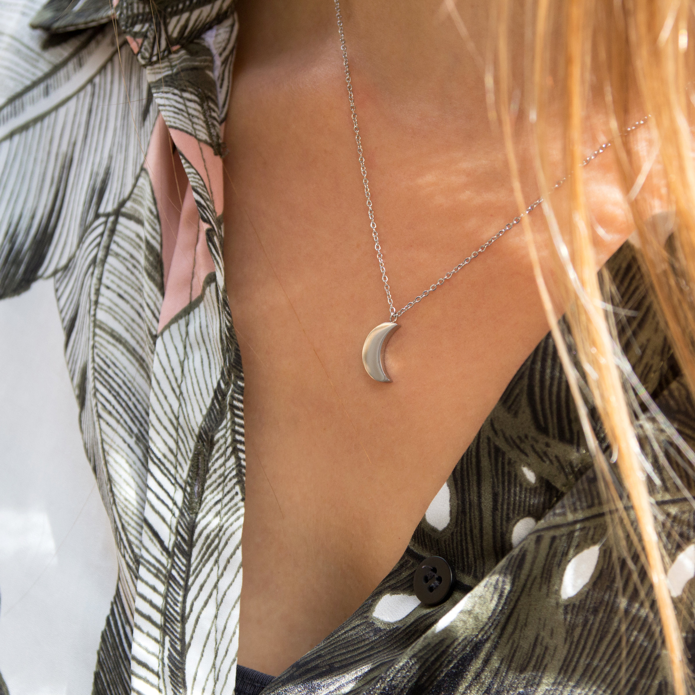 Kuku silver crescent moon necklace on model
