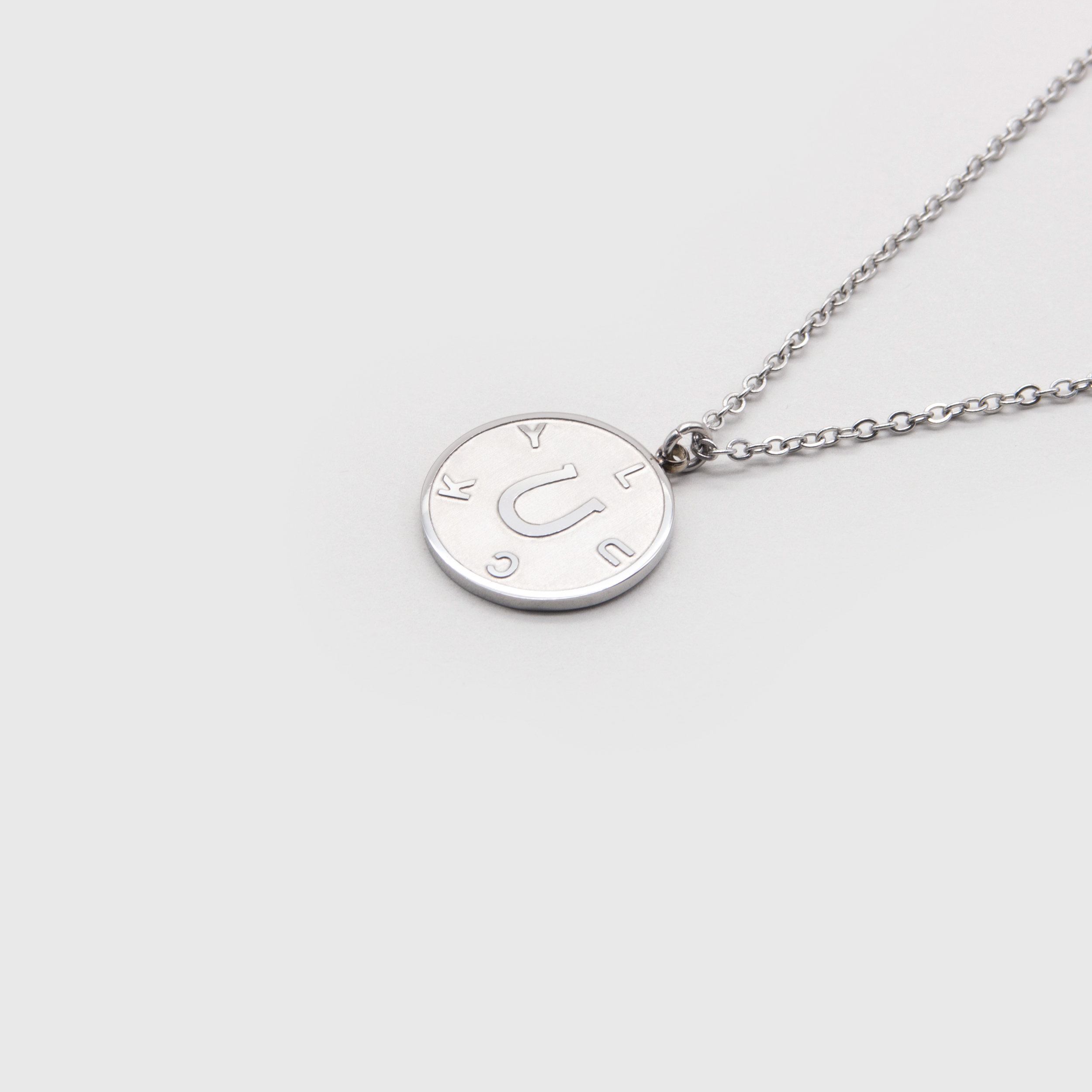 Kuku lucky silver coin necklace with horseshoe