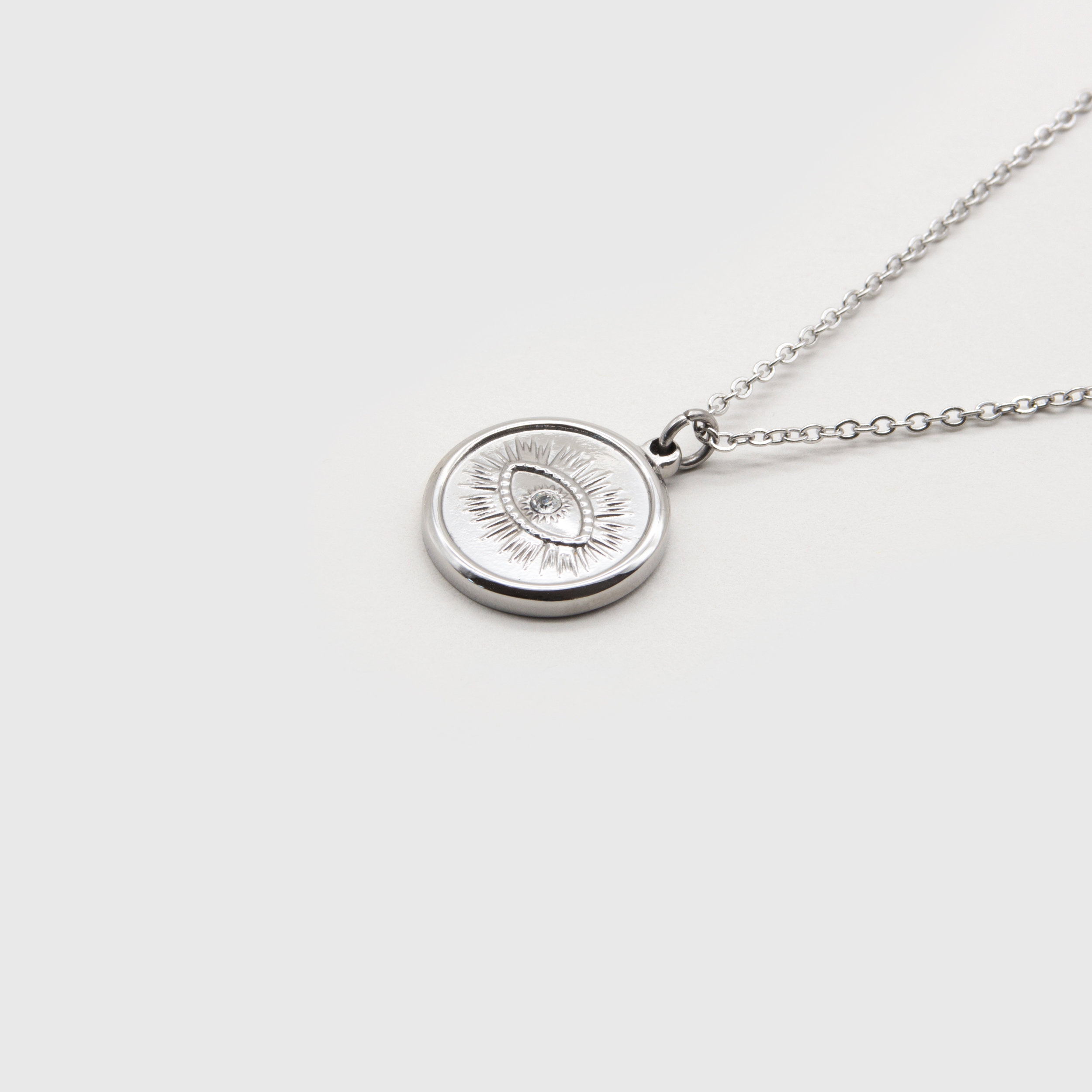 Kuku silver eye coin necklace with stone