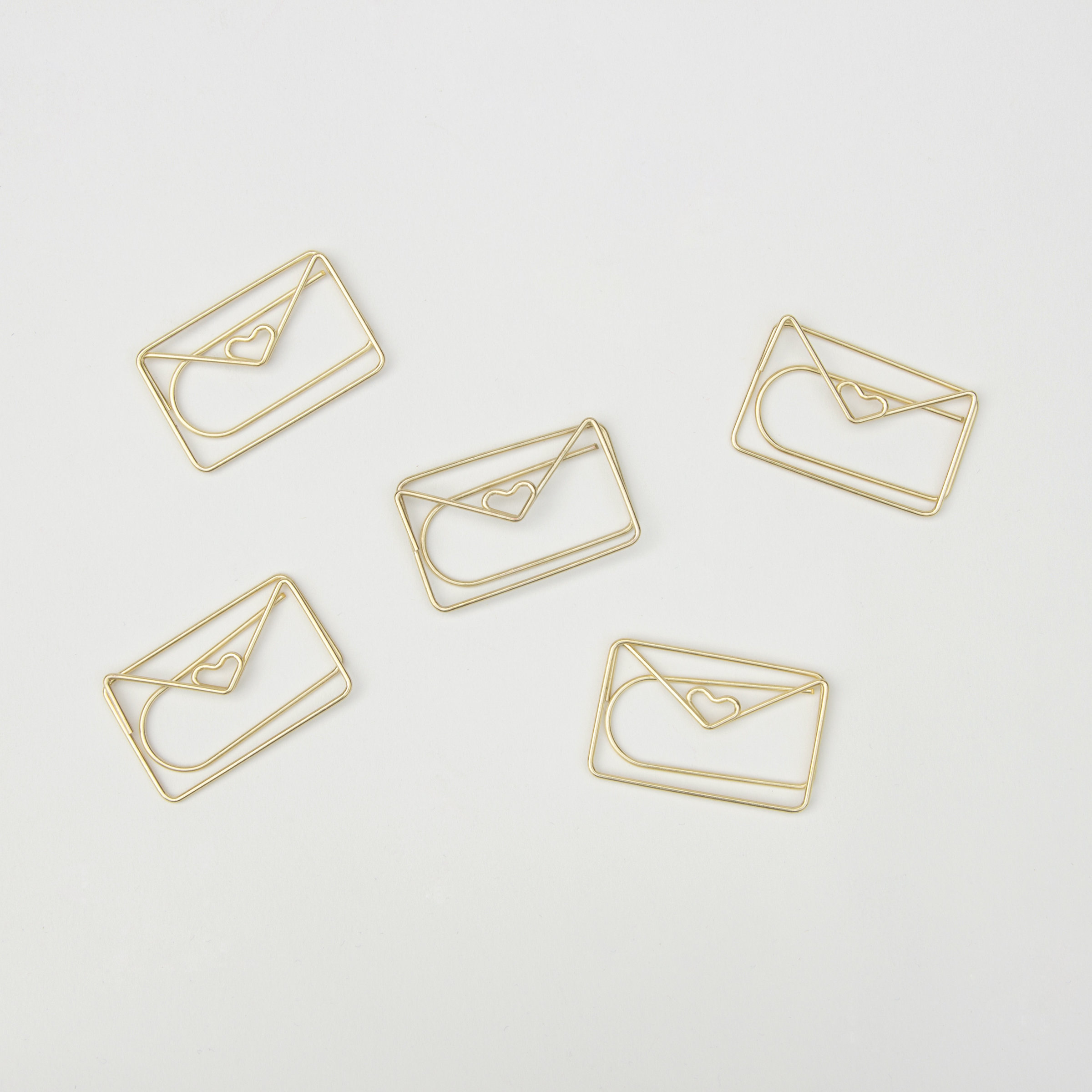Envelope shaped paper clips in gold