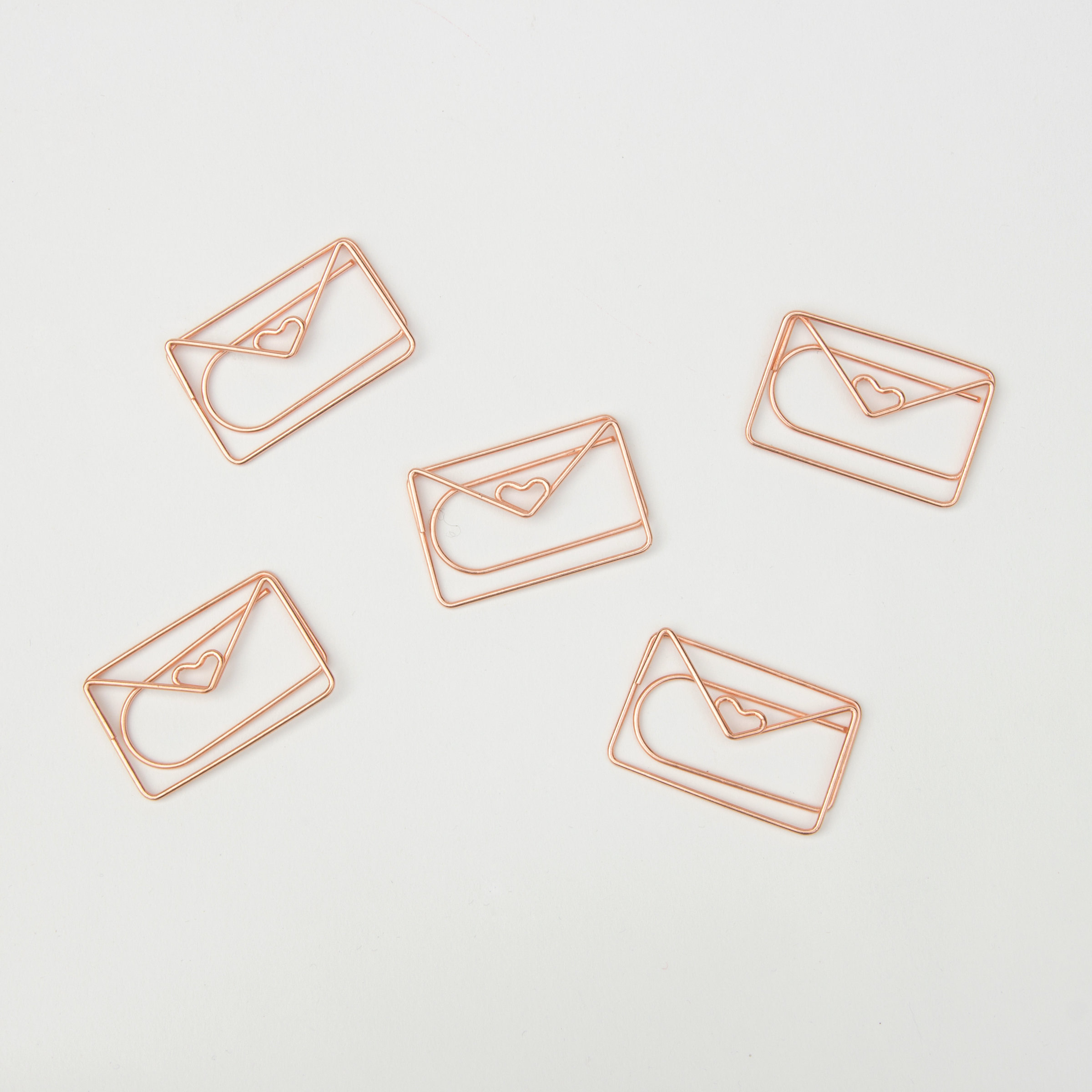 Rose gold envelope shaped paper clips