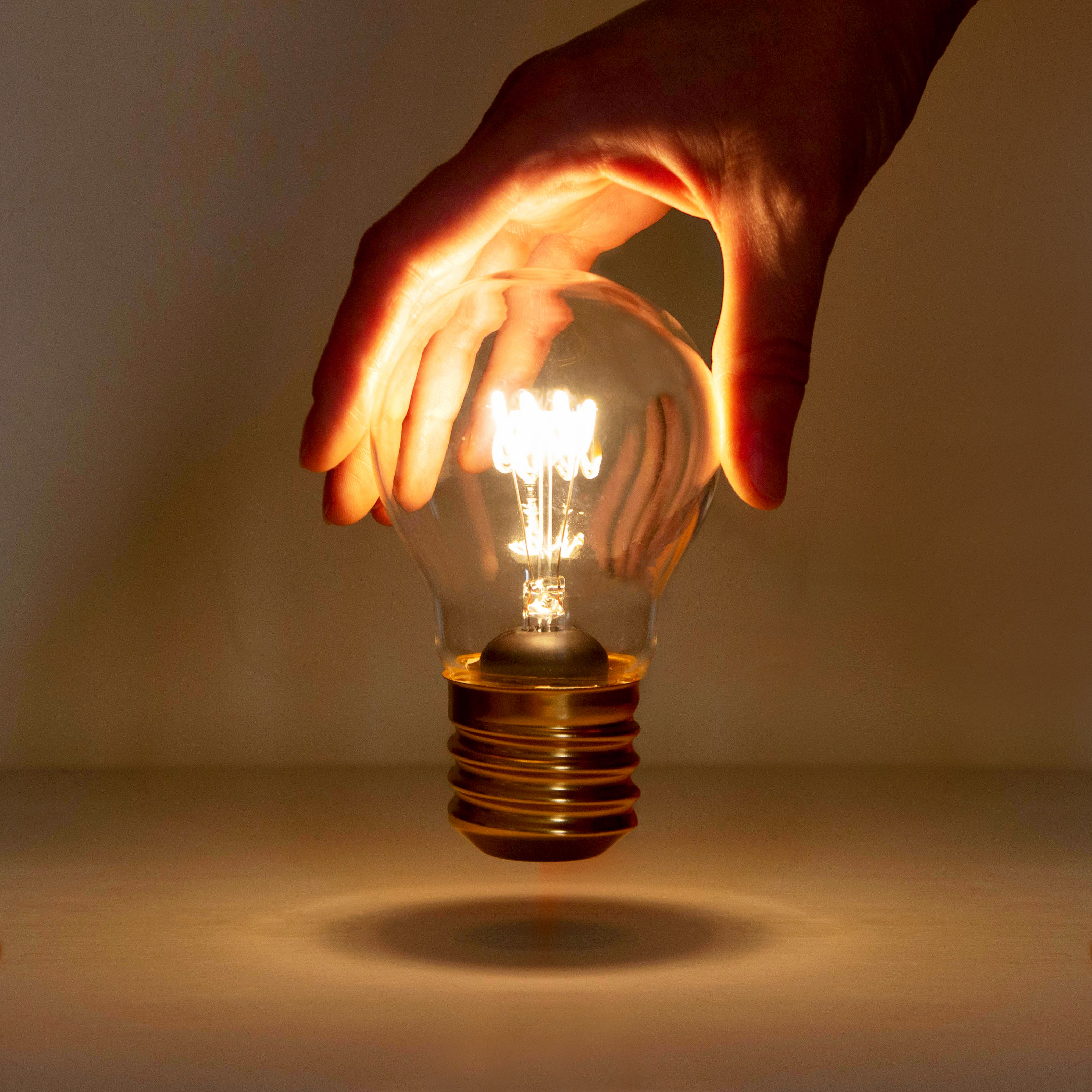 Collection 94+ Images light bulb that lights up in your hand Stunning