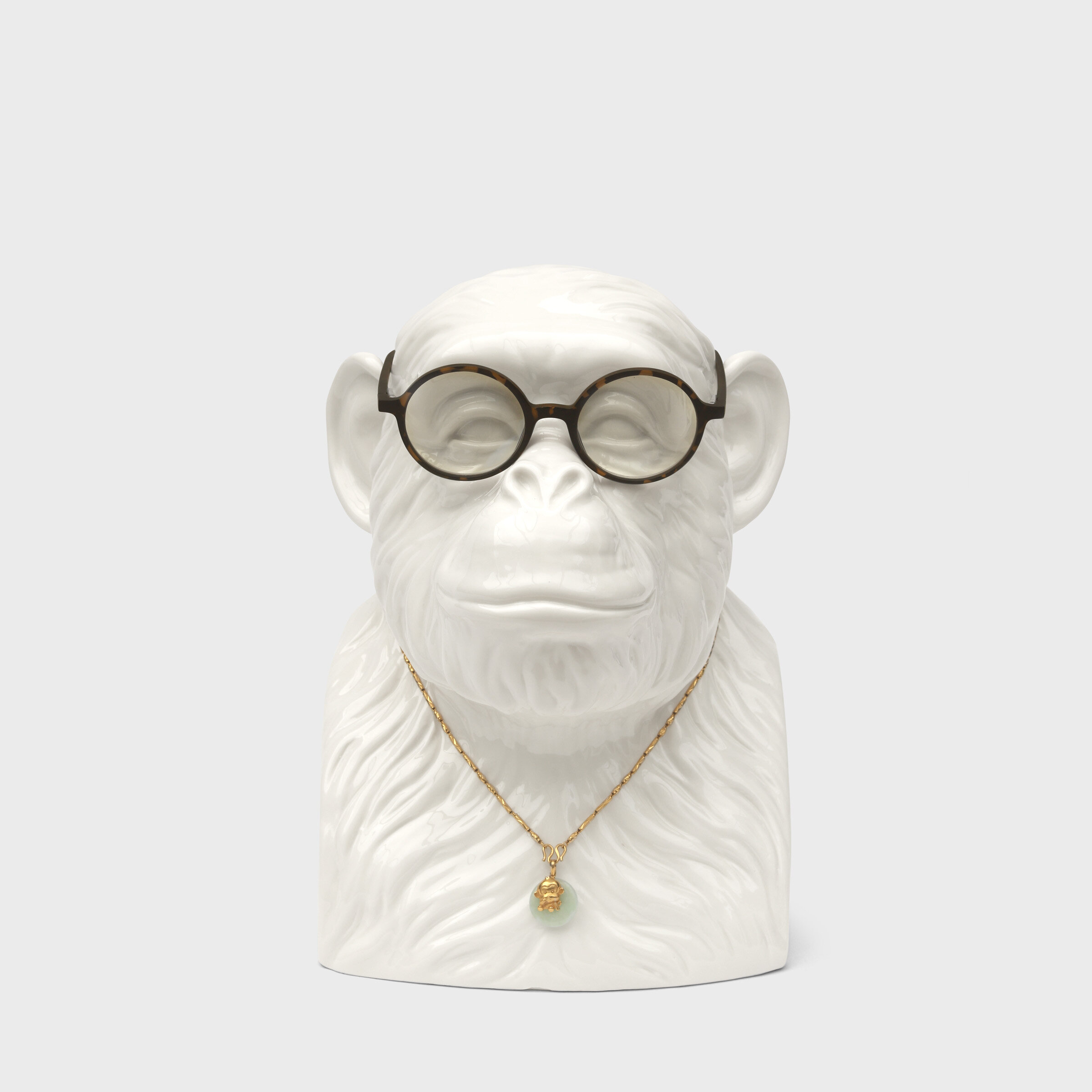 chimp with glasses and necklace