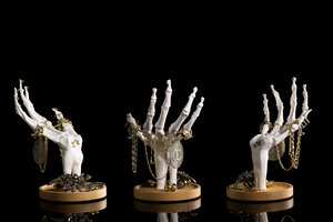 Three Skeleton Hands holding 