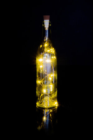 LED String lights in an empty glass bottle