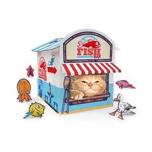 Ginger cat inside cardboard cat fish and chip shop with fold up toys