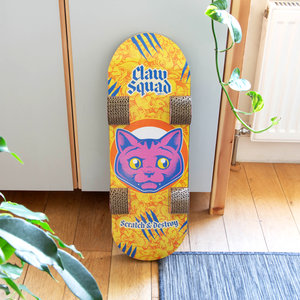 Cat skateboard leaning against cupboard