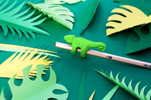 Chameleon eraser on wooden pencil with paper cut leaves