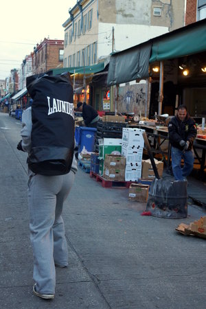 man walking with  cheap punching bags