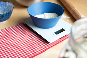 Scales weighing flour close up