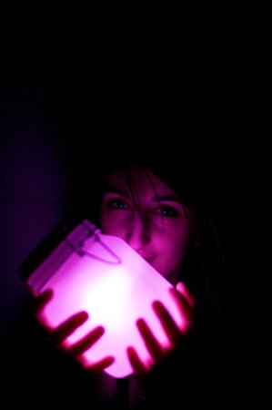girl holding sun jar at night