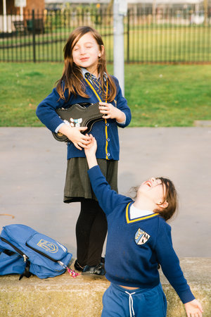 kids playing with lunchbox