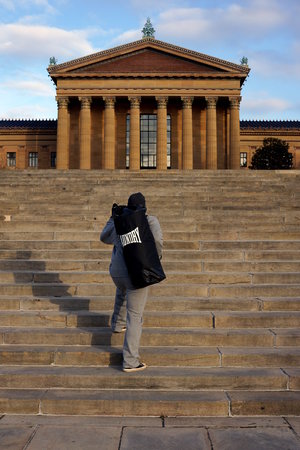 running up stairs with new laundry bag design