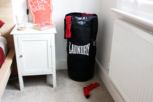 laundry bag in corner with foam finger