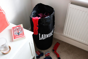 laundry bag with bedside table and cork coaster